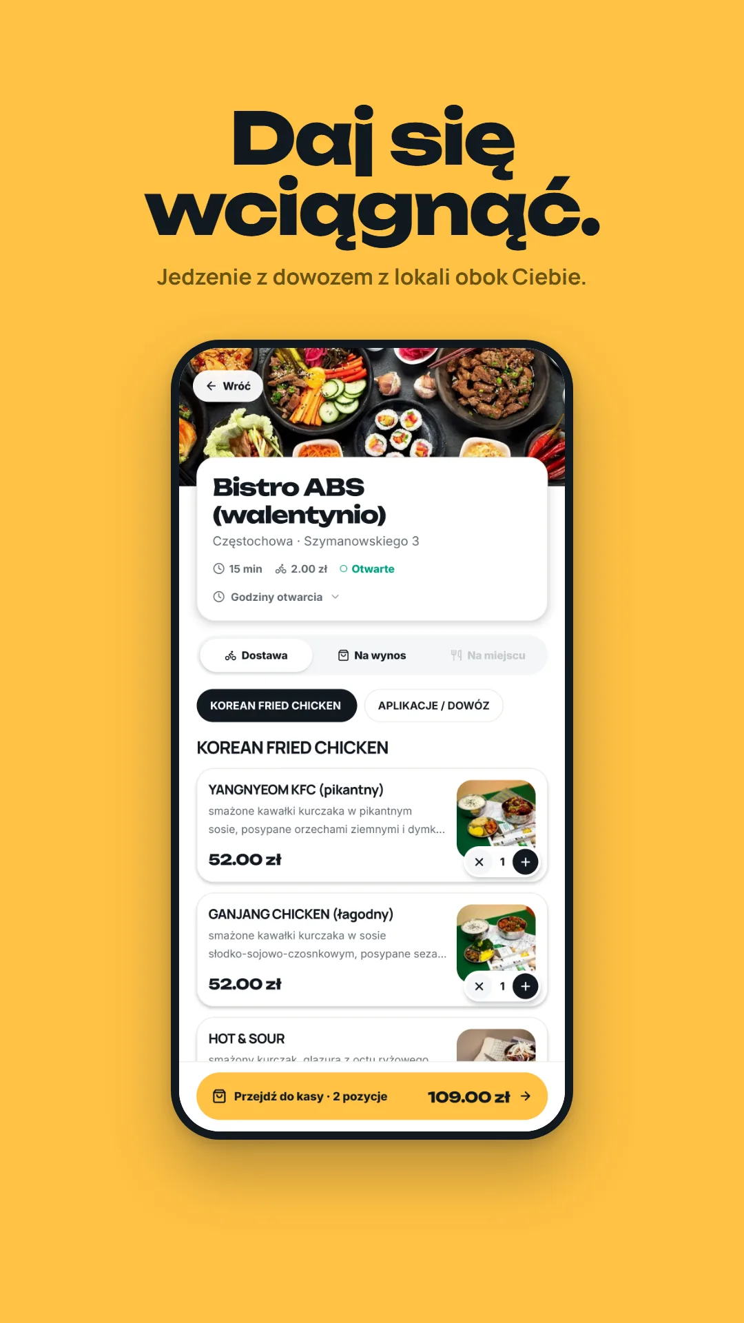 Karta lokalu w aplikacji: nazwa, adres, czas dostawy i godziny otwarcia, przełącznik dostawa / na wynos / na miejscu oraz menu z cenami. Na dole pasek „Przejdź do kasy — 2 pozycje, 109 zł”.